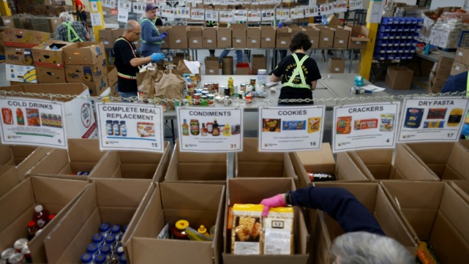 Volunteers sort through donated groceries at Daily Bread Food Bank in Toronto, Canada