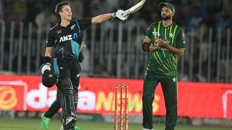 New Zealand's Mark Chapman (L) celebrates after scoring a century