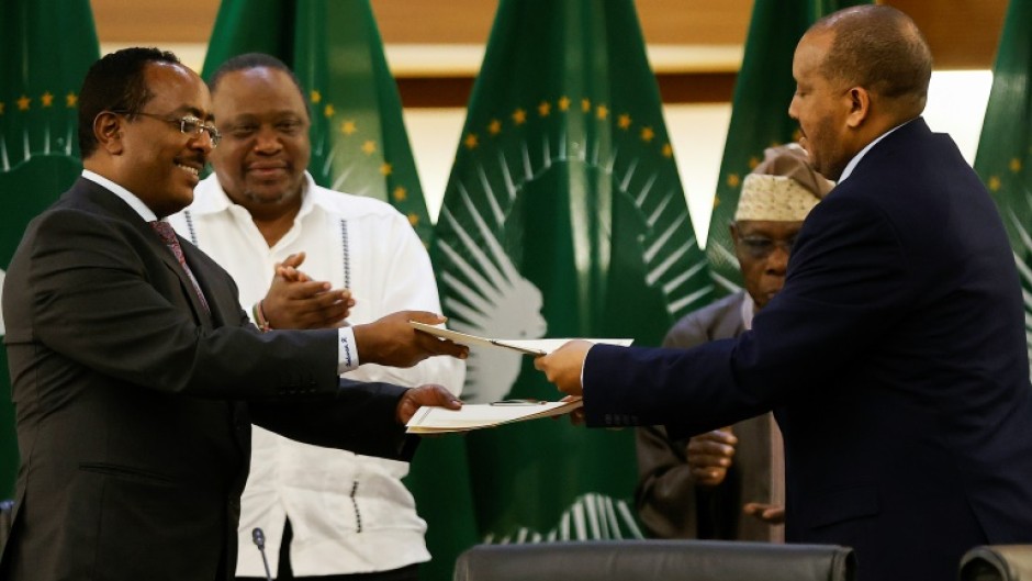 Ethiopian government representative Redwan Hussein (left) and Getachew Reda of the Tigray People's Liberation Front (TPLF) signed the peace deal in Pretoria 