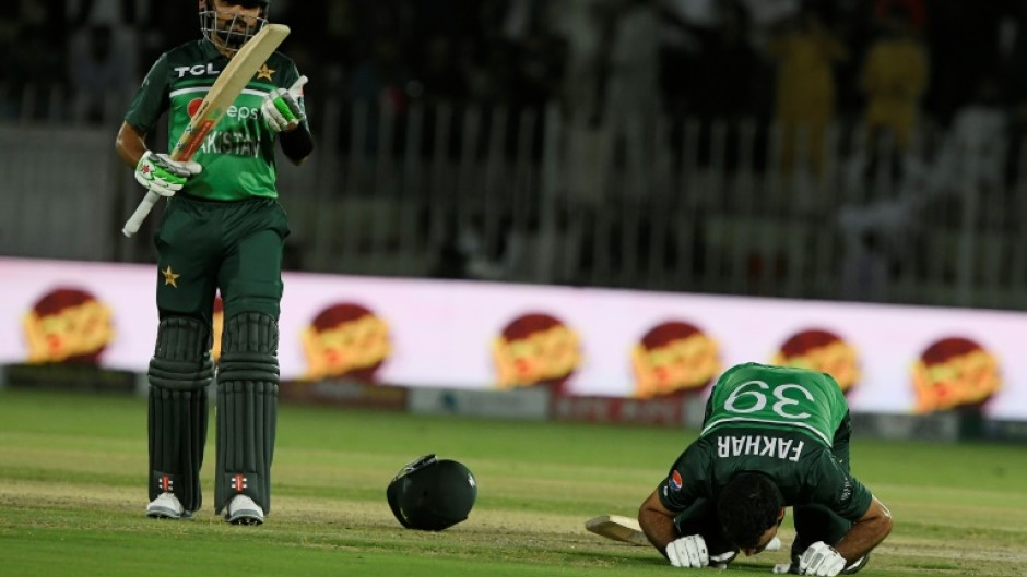 Moment of celebration: Pakistan's Fakhar Zaman (right) celebrates after scoring his century on Thursday