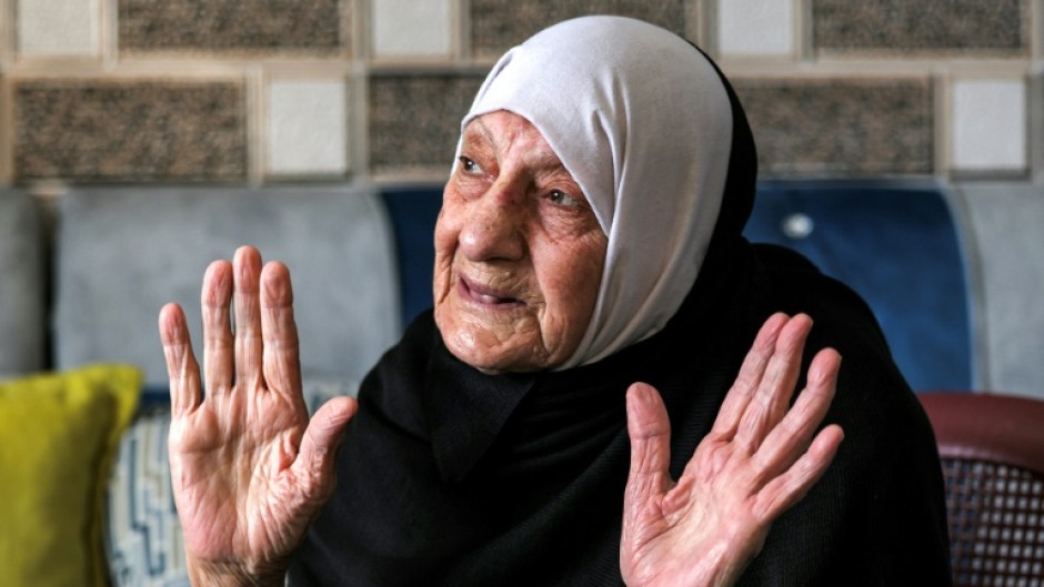 Refugee Amina al-Dabai says she would not accept compensation and no longer expects to return, but 'future generations will liberate the country'