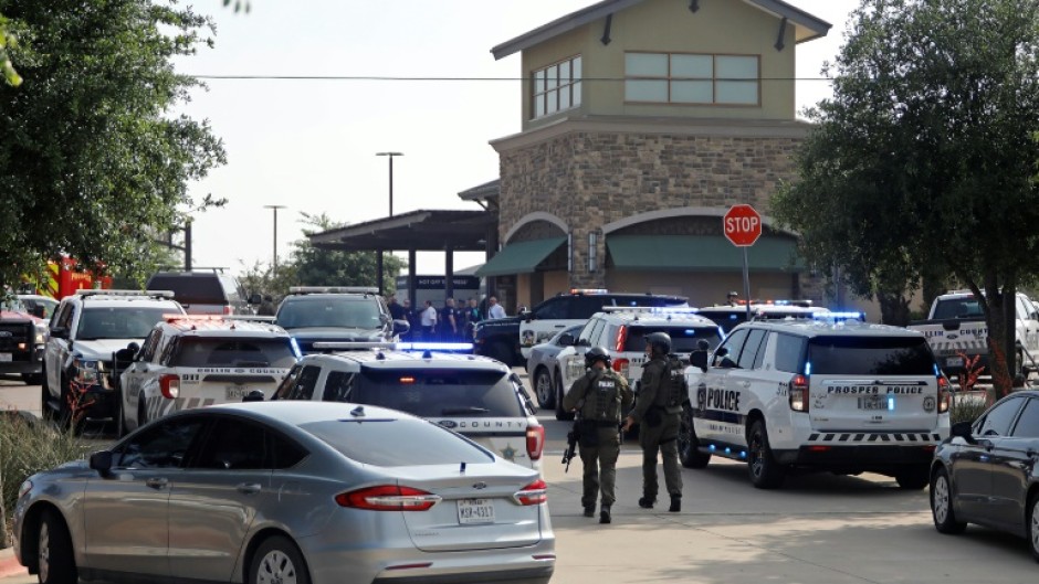 Emergency personnel work the scene of a deadly shooting at a shopping mall in Allen, Texas on May 6, 2023