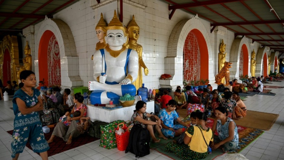 People shelter at a monastery in Sittwe town in Myanmar's Rakhine state on Friday