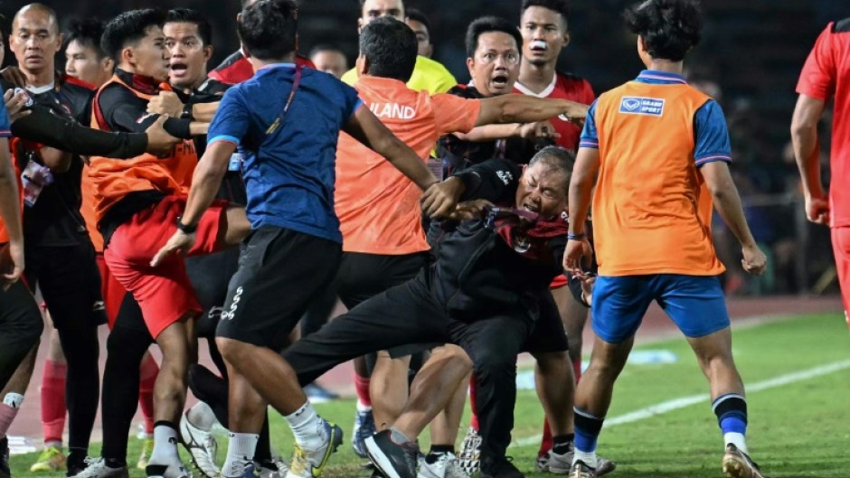 A fight breaks out on the sidelines of the men's final between Thailand and Indonesia