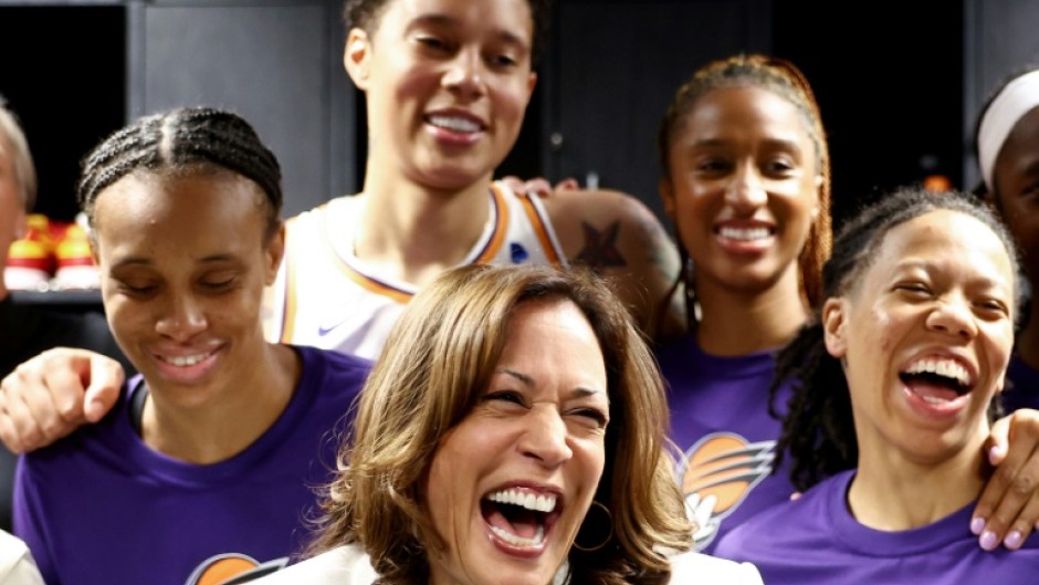 US Vice President Kamala Harris (center) laughs with Brittney Griner (top) and other Phoenix Mercury players before their game in Los Angeles on Friday