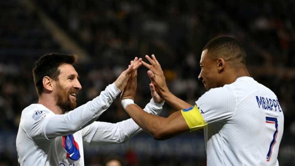 Lionel Messi celebrates with Kylian Mbappe after scoring for Paris Saint-Germain as they drew 1-1 in Strasbourg on Saturday to clinch the Ligue 1 title