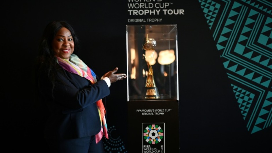 FIFA Secretary General Fatma Samoura poses next to the Women's World Cup trophy