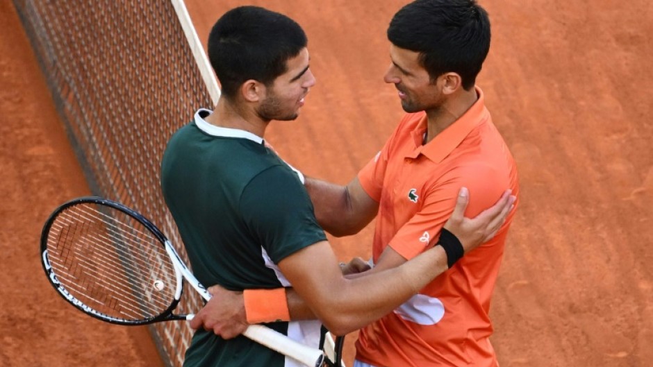 New era? Carlos Alcaraz (left) after defeating Novak Djokovic in the Madrid Open semi-finals in 2022