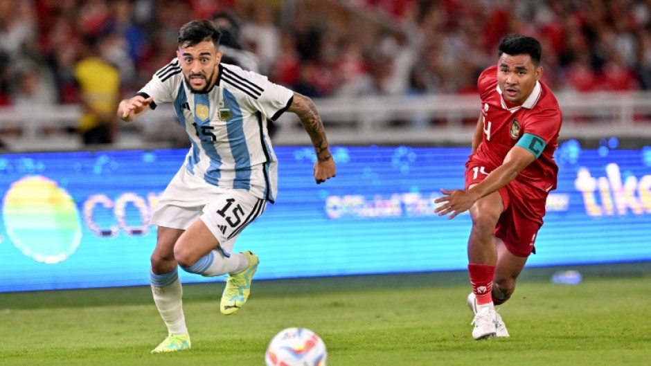Nicolas Ivan Gonzalez and Asnawi Mangkualam Bahar contest the ball during Argentina's 2-0 friendly win over Indonesia in Jakarta