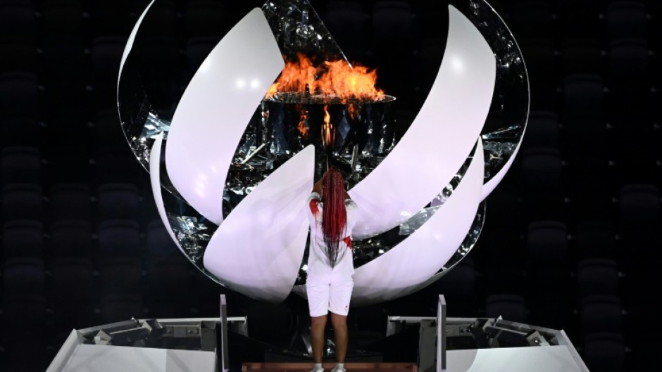 Japan's tennis star Naomi Osaka lit the flame at the opening ceremony of the pandemic-delayed Tokyo 2020 Games, which took place in 2021