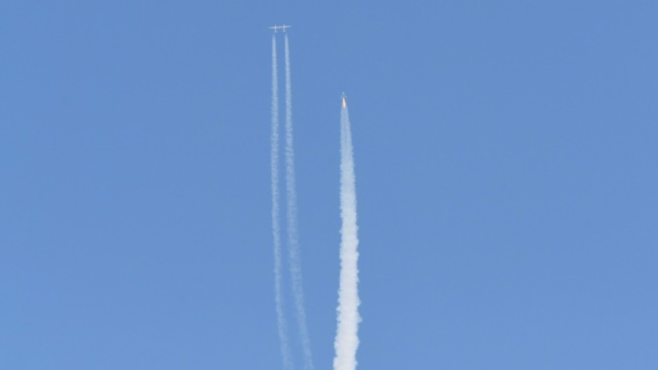 The Virgin Galactic SpaceShipTwo space plane Unity and mothership separate as they fly way above Spaceport America in New Mexico on July 11, 2021