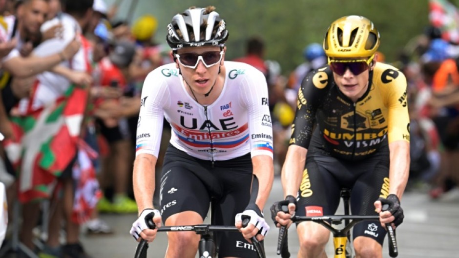 Tadej Pogacar (L) tailed by defending champion Jonas Vingegaard on stage one of the Tour de France