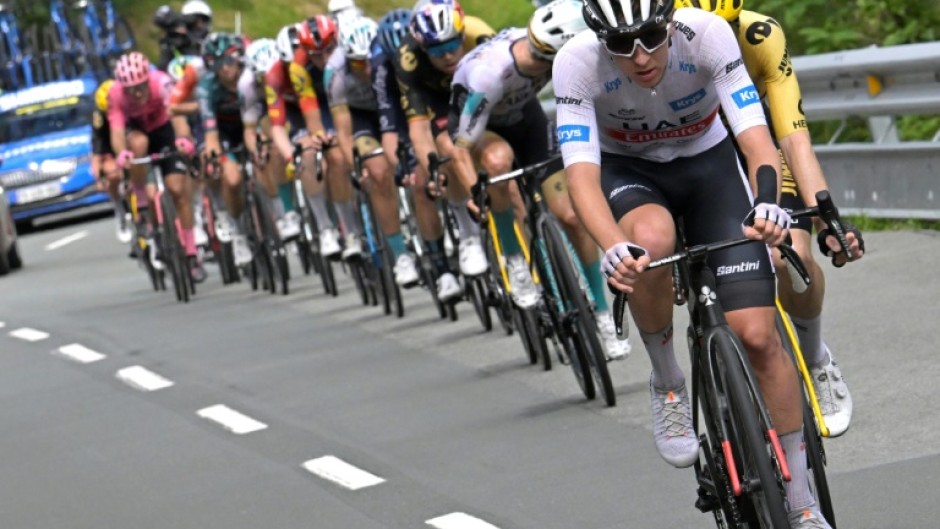 Tadej Pogacar riding downhill at the head of the lead clique 