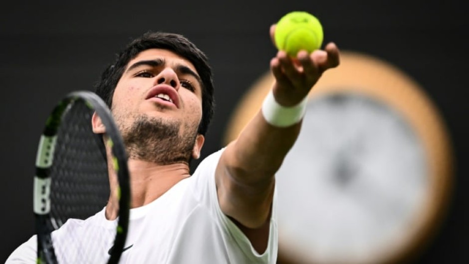 Spain's Carlos Alcaraz serves to France's Jeremy Chardy at Wimbledon