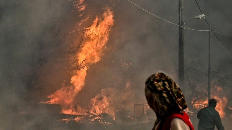 Local residents watch raging wildfires in Greece