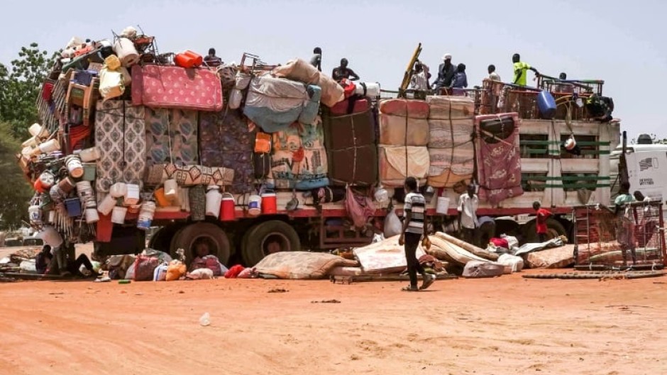 A truck carrying mattresses and pieces of furniture parked along the road connecting Sudan's capital to the city of Wad Madani