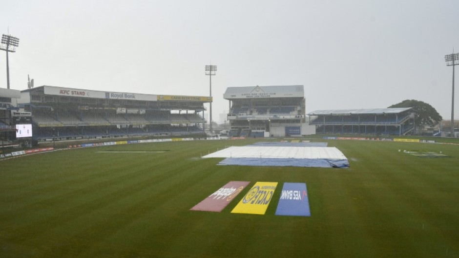 Rain delays play during the fifth and final day of the second Test cricket match between India and West Indies at Queen's Park Oval