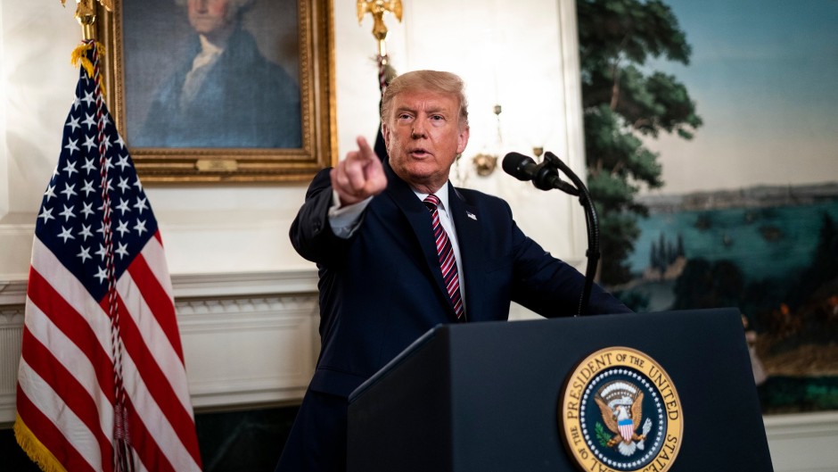 FILE: US President Donald Trump explained that he wanted to avoid causing panic.