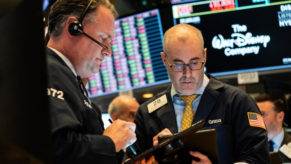 The greenback held gains against most currencies after a blowout in swap spreads showed investors are facing a shortage of dollars as equity markets plunged on fears about the economic impact of the flu-like virus.