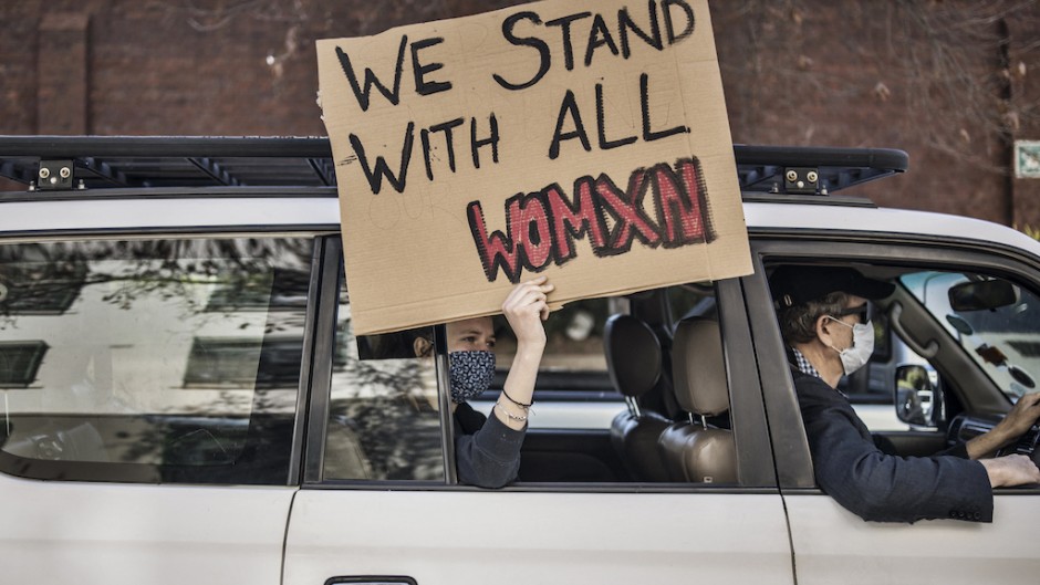 File: A woman holds a placard at a demonstration against gender-based violence in Johannesburg. AFP/Marco Longari