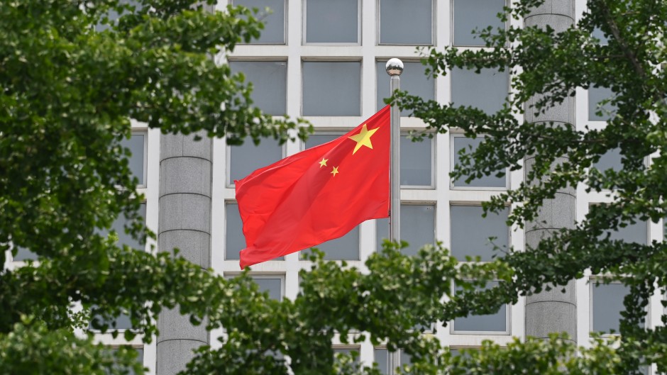 File: The Chinese national flag flies outside the Ministry of Foreign Affairs in Beijing on July 26, 2023. 