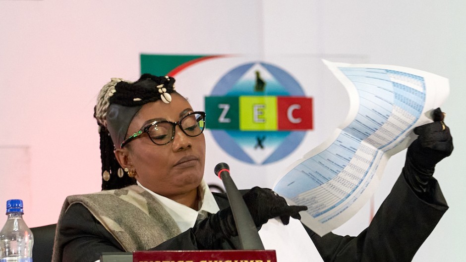 Zimbabwe Electoral Commission (ZEC) Chairperson Priscilla Chigumba reads the Zimbabwe Presidential election results announcing victory for Emmerson Mnangagwa. AFP/Jekesai Njikazana