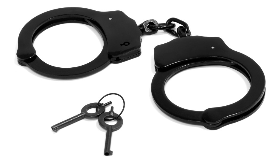 File image of black handcuffs