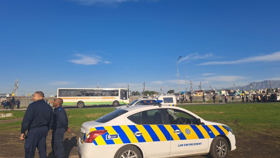 Metro police officers keeping an eye on the Cape Town taxi strike.