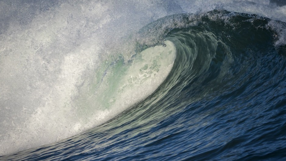File: An Atlantic Ocean wave breaking, spray flying on the Hermanus shore. Roger de La Harpe/Biosphoto via AFP