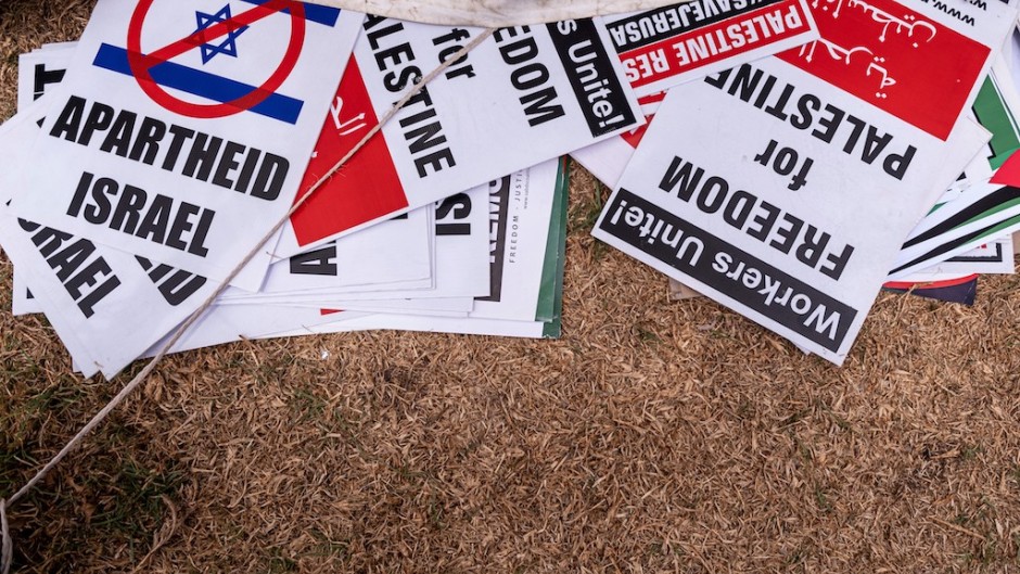 Placards are seen on the ground after a pro-Palestinian demonstration in Lenasia. AFP/Emmanuel Croset