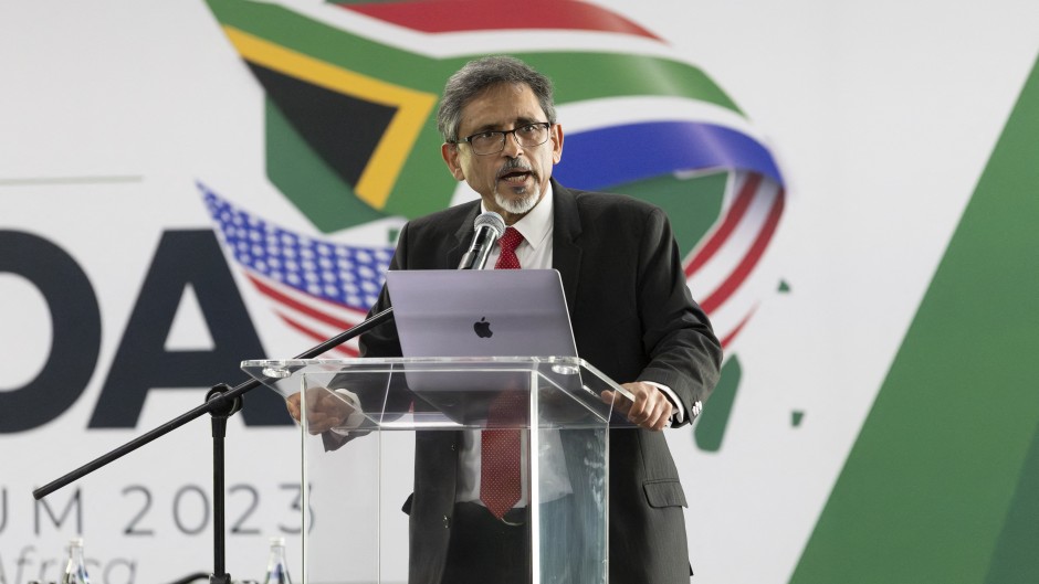 Minister of Trade and Industry of South Africa Ebrahim Patel (R) speaks on the first day of the 20th African Growth and Opportunity Act (AGOA) summit in Johannesburg on November 2, 2023.