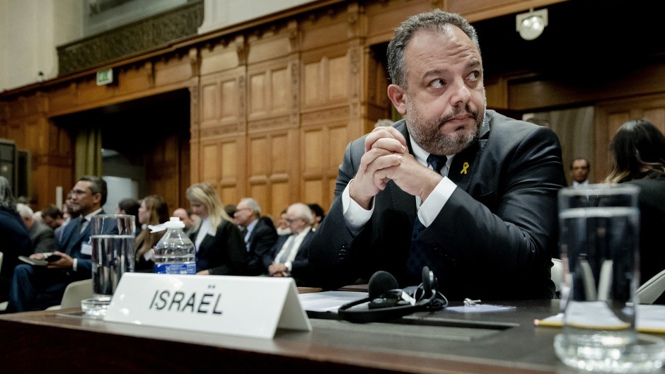 Legal Counselor of the Ministry of Foreign Affairs of Israel Tal Becker (C) looks on at the International Court of Justice (ICJ) in The Hague on January 12, 2024.