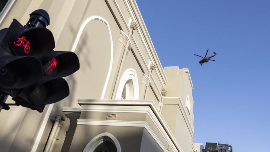 A SANDF helicopter does a fly-over at the Cape Town City Hall. AFP/Marco Longari