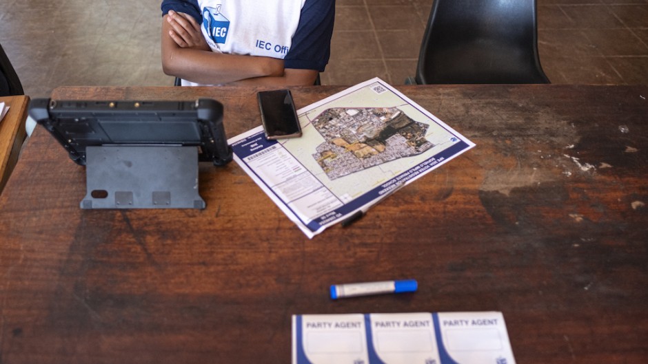 An IEC official waits for voters to be registered at a voting station. AFP/Emmanuel Croset
