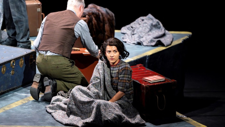 Cast members sit within a concrete Star of David divided into sections representing the rooms in the "secret annex" where the Frank family and four others hid. AFP/Nick Gammon
