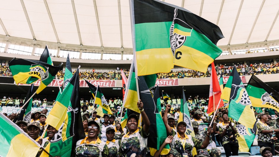 Supporters of the African National Congress (ANC) wave flags during the Election Manifesto launch. AFP/Rajesh Jantilal