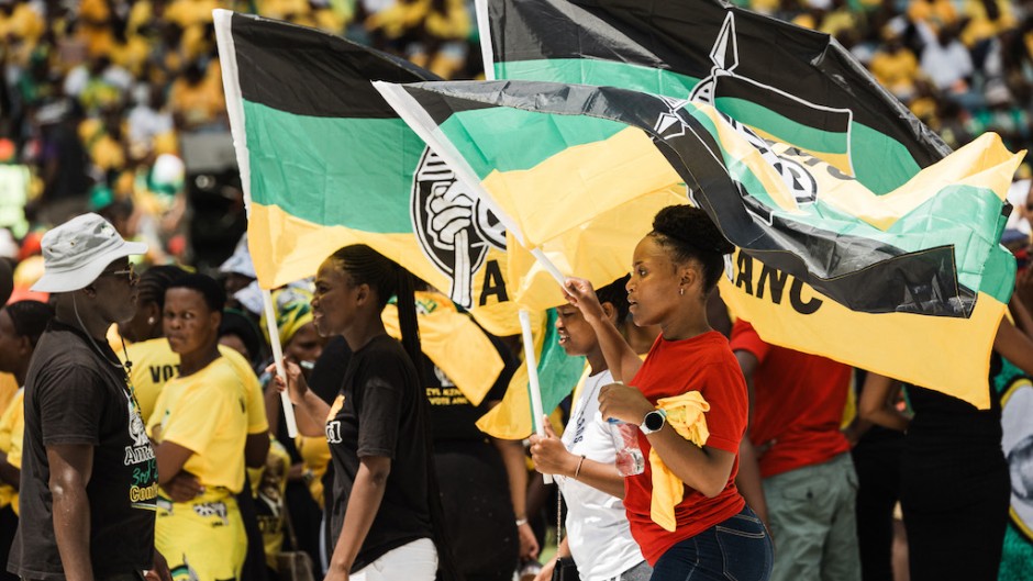 Supporters display ANC flags during the Election Manifesto launch. AFP/Rajesh Jantilal