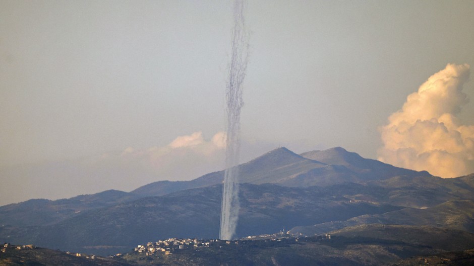 This picture taken from an Israeli position along the border with southern Lebanon shows rockets fired from Lebanon into Israel. AFP/Jalaa Marey