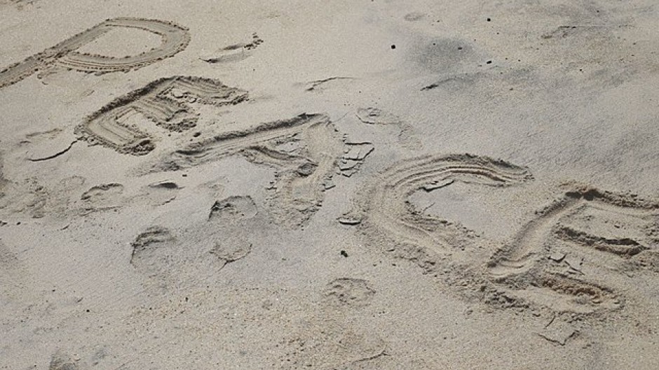 The word "peace" written on a beach. Wikimedia Commons/Yaw Kuma Ansu-Kyeremeh