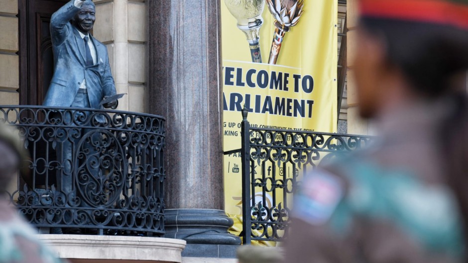 A SANDF member looking at Cape Town City Hall ahead of SONA 2024. GCIS