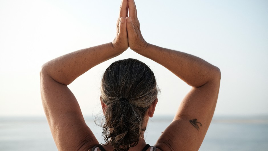 File: A woman doing a yoga pose. AFP/Hans Lucas/Valendino Belloni