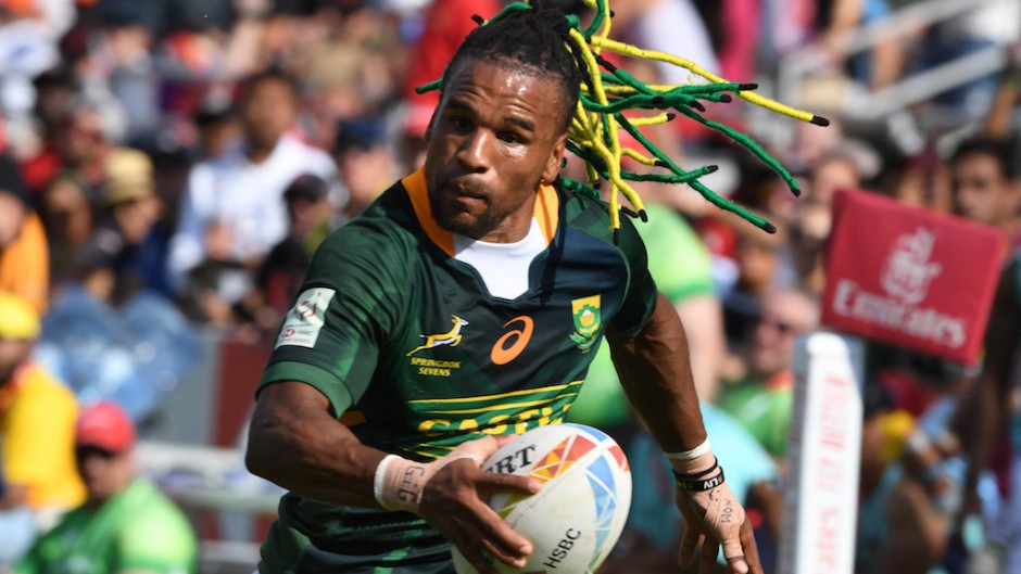 File: Rosko Specman of South Africa runs with the ball. AFP/Karim Sahib