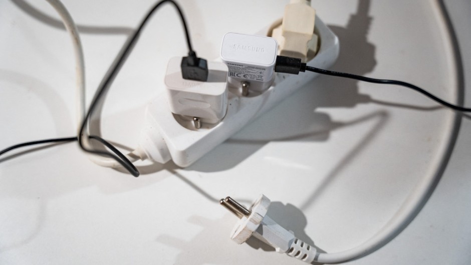 File: Multiple plugs in an electrical outlet. AFP/Jean-Marc Barrere/Hans Lucas