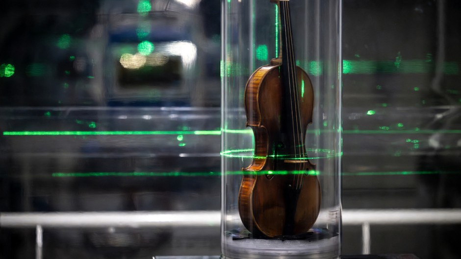 The world's most famous violin, "Il Cannone", made in 1743 and played by the great virtuoso Niccolo Paganini, being examined. AFP/Jean-Philippe Ksiazek