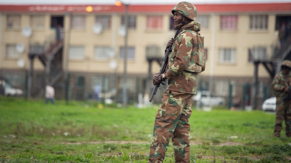 File: A SANDF soldier patrols a street in Hanover Park. AFP/Rodger Bosch