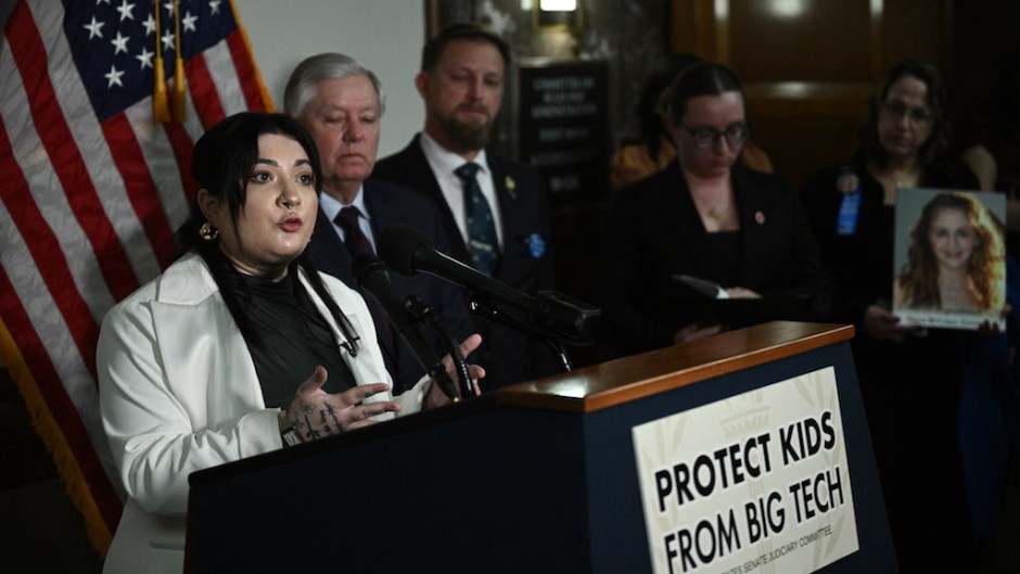 Leah Juliett, a survivor of sextortion, speaks at a press conference after the US Senate Judiciary Committee hearing. AFP/Brendan Smialowski