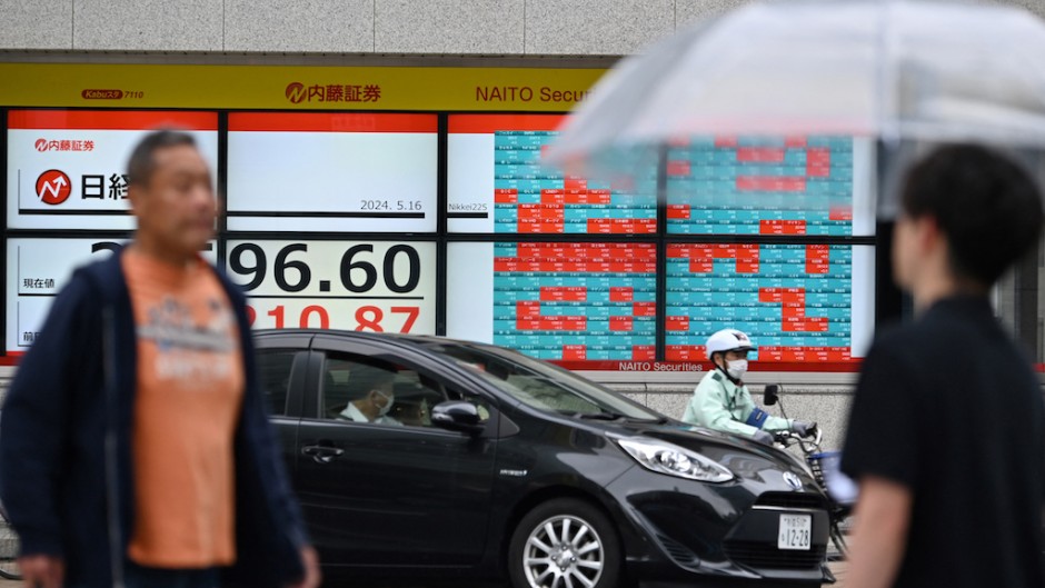 Electronic boards displaying the Nikkei index of the Tokyo Stock Exchange. AFP/Kazuhiro Nogi