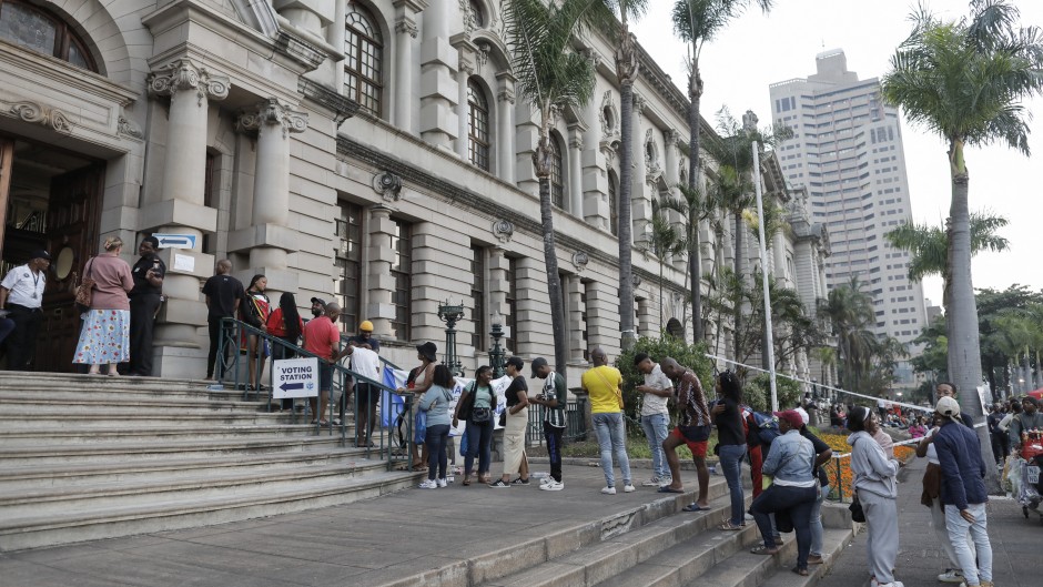 File: Voters queue at the Durban City Hall in Durban on May 29, 2024, during South Africa's general election. 