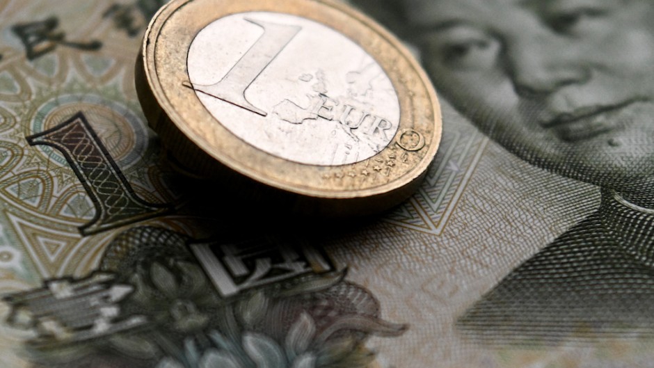 File: A Euro coin and a Chinese yuan banknote. AFP/Kirill Kudryavtsev