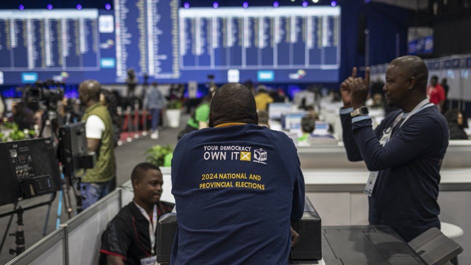 File: An IEC staff member leans against a booth at the Independent Electoral Commission (IEC) National Results Center in Midrand on May 31, 2024. 